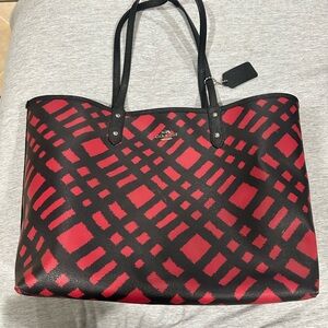 Coach reversible City Tote in a red and black wild plaid